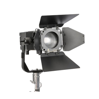 Astera Leo Fresnel front angle view showing fresnel lens with barndoors open, yoke mount and chrome stand adapter, white background