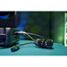 LumenRadio MoonLite 2 wireless DMX CRMX transceiver in use on set connected to lighting fixture via XLR cable with green stage lighting in background lifestyle promotional shot