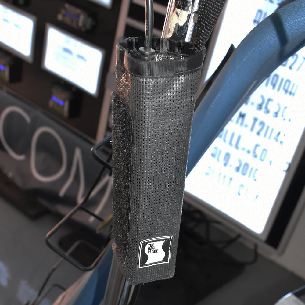 Moss Illumination MI Fixture PSU holder with MeanWell power supply mounted on lighting stand on professional film set showing cables connected and velcro closure