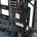 Moss Illumination MI Fixture PSU holder mounted on lighting stand in studio environment showing LuxBox V3 controller installed with cables connected professional film set