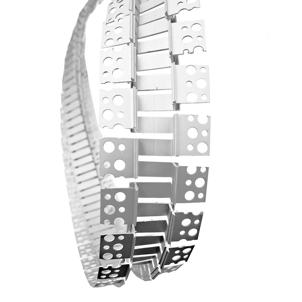 Moss LED ALSST-6114F flexible aluminum channel bent in a curve close-up view demonstrating flexibility of mounting wings and channel segments silver white background