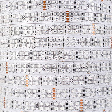 Moss LED FlexLED 240 RGBA 24V extreme close-up showing individual RGBA LED diodes on white PCB with component markings mossled branding and orange cut marks