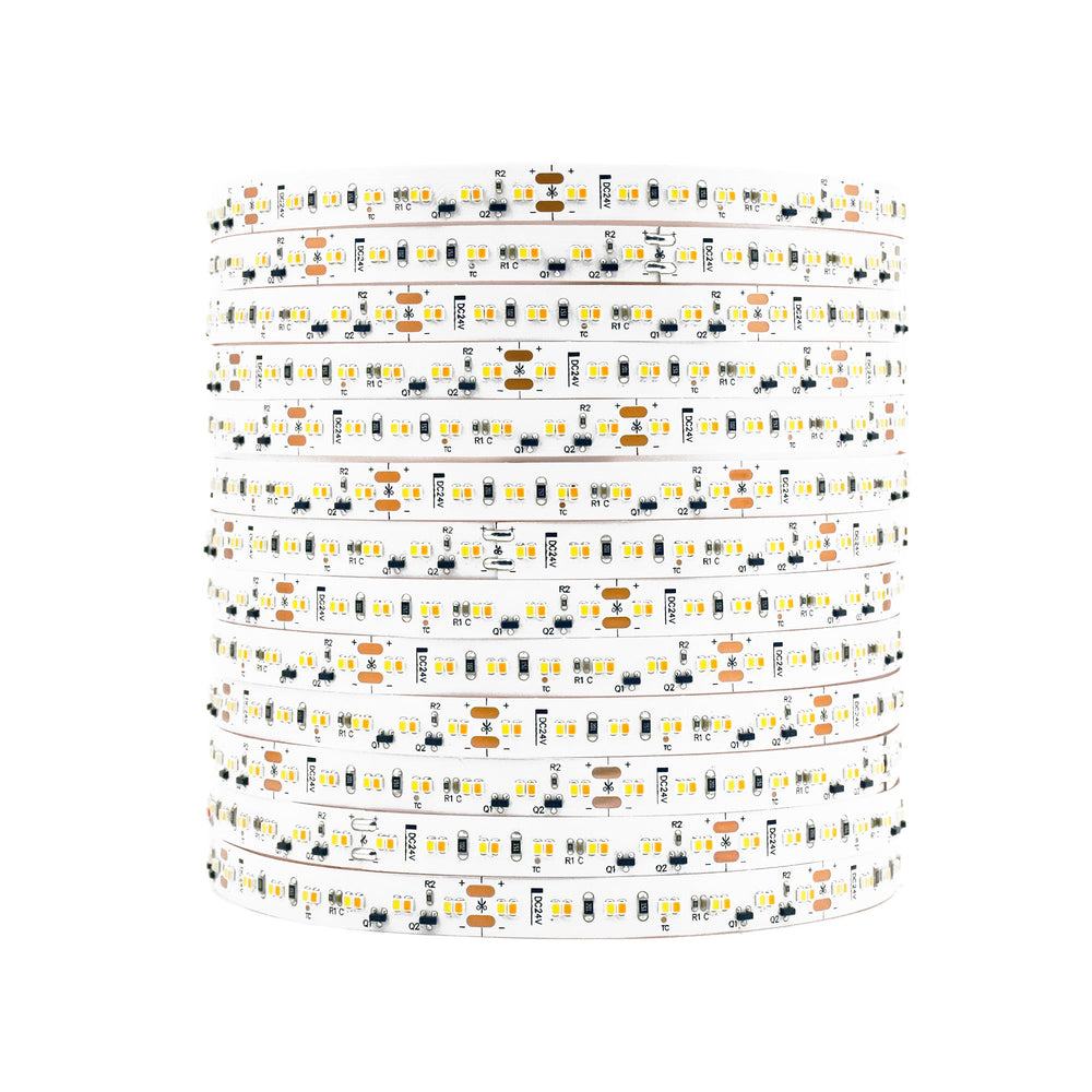 Moss LED FlexLED Bi-Colour 24V LED strip coiled reel unlit showing white PCB with warm and cool white LED components on white background