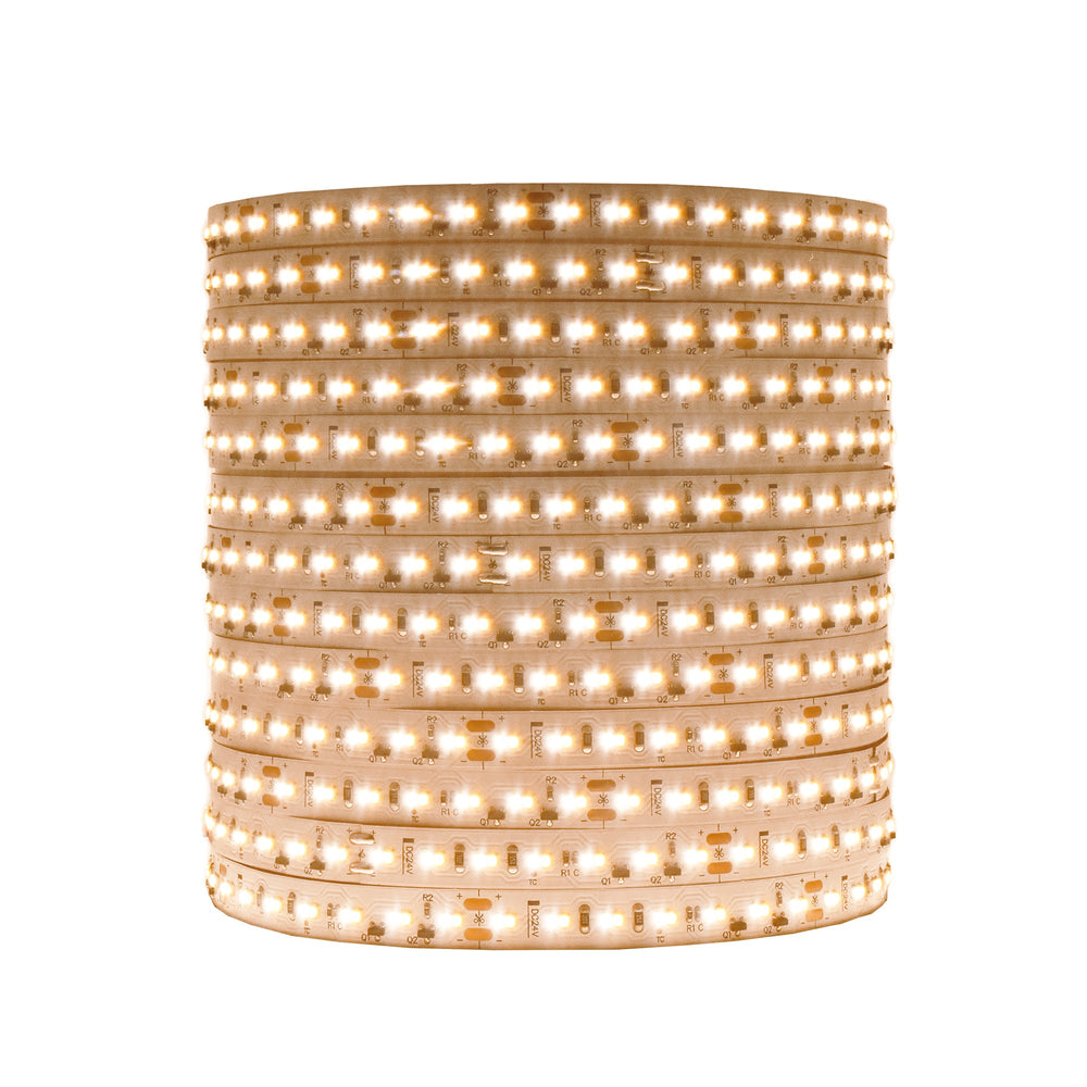 Moss LED FlexLED Bi-Colour 24V LED strip coiled reel lit in warm neutral white showing flexible PCB with dual color temperature LEDs on white background
