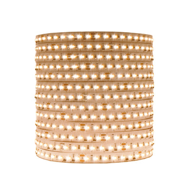 Moss LED FlexLED Bi-Colour 24V LED strip coiled reel lit in warm neutral white showing flexible PCB with dual color temperature LEDs on white background