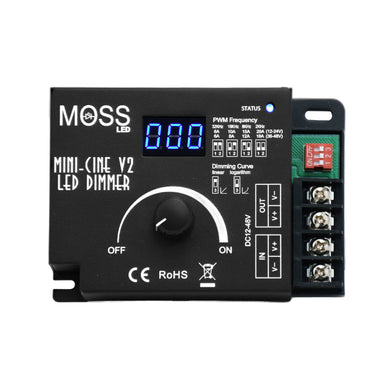 Moss LED MiniCine V2 single channel rotary dimmer top view showing blue LED digital display rotary knob PWM frequency DIP switches dimming curve selector screw terminal connectors CE RoHS black housing