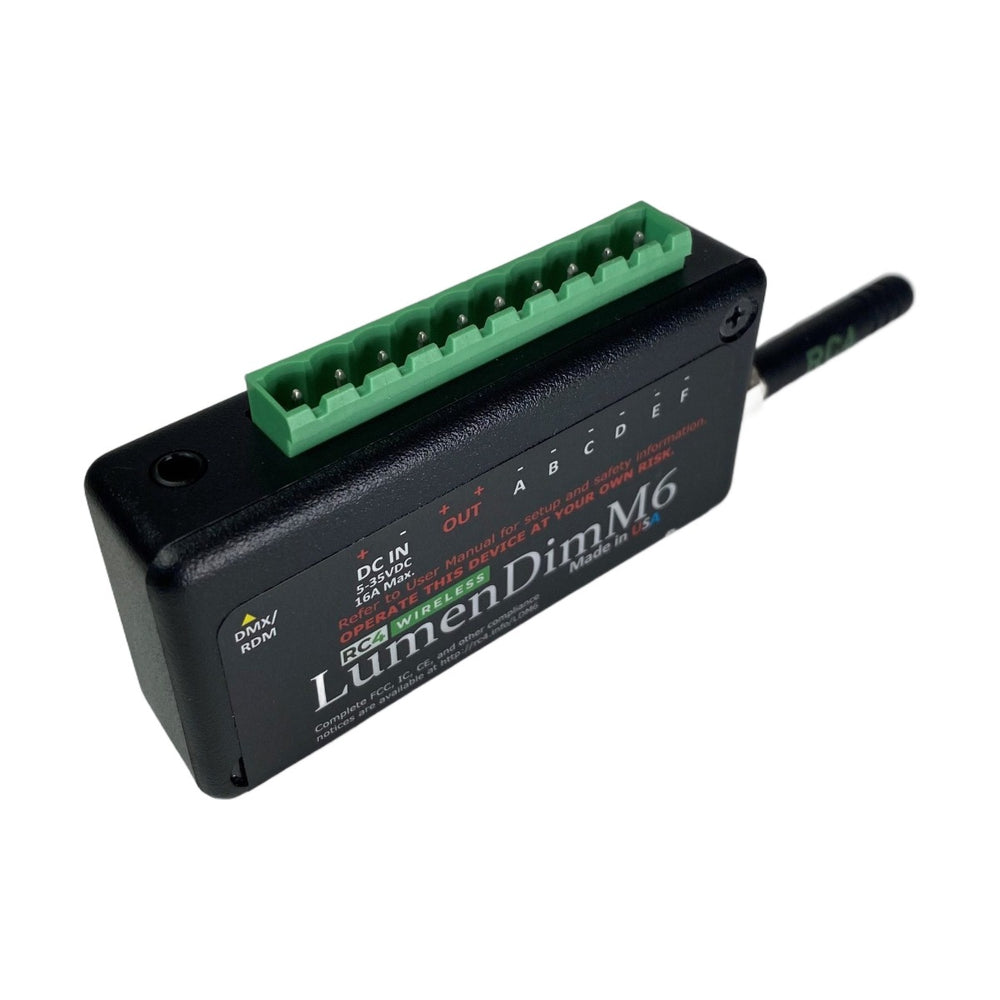 RC4 Wireless LumenDimM6 miniature 6 channel CRMX wireless DMX dimmer with green Phoenix plug-in connector top angle view with external antenna on white background