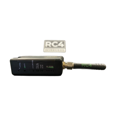 RC4 Wireless LumenDimMIOR2 CRMX wireless DMX RDM transceiver side view with SMA antenna attached showing LED indicators RF RSSI status lights and RC4 Wireless branding on white background