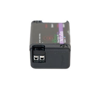 RC4Magic S3 DMX2dim 2-channel wireless dimmer side end view showing screw terminal output connectors, top label with purple stripe branding, black housing, white background