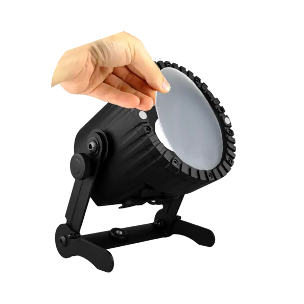Astera 32 degree FloodFilter for AX5 TriplePAR hand inserting frosted filter onto black LED fixture on transparent background