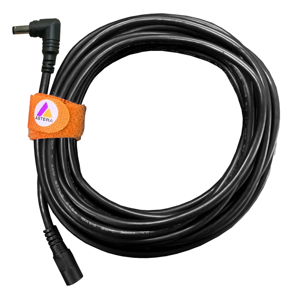 Astera AX1 single extension cable 5m male to female DC barrel connector coiled black cable with orange Astera velcro tie on transparent background