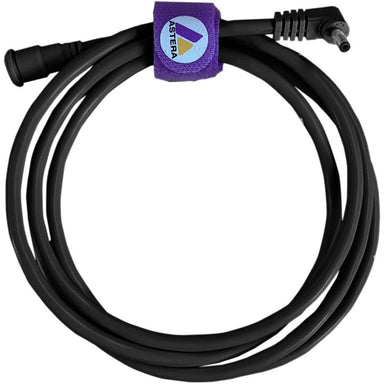 Astera FP5-EXC DC power extension cable coiled black cable with right-angle barrel connectors and purple Astera branded velcro cable tie strap for extending power to Astera LED lighting fixtures on white background