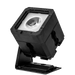 Astera PB15 PixelBrick compact LED light front angle view showing square black housing with bright COB LED lens reflector mounted on adjustable tilt bracket with base plate for professional wireless film and event lighting on transparent background