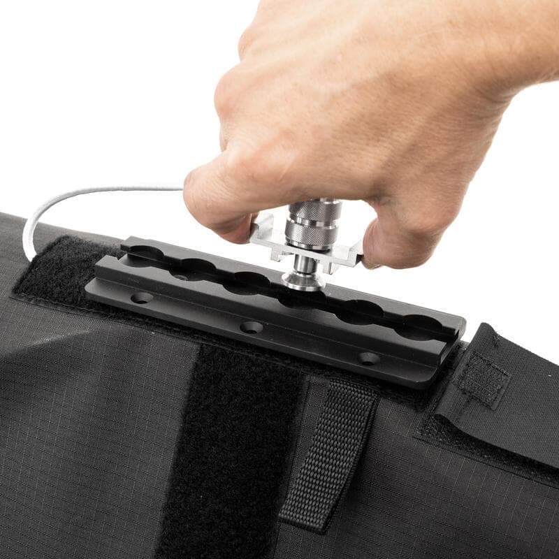 Astera SNAPBAG for Helios single tube close-up of baby pin spigot mount being tightened by hand for light stand attachment