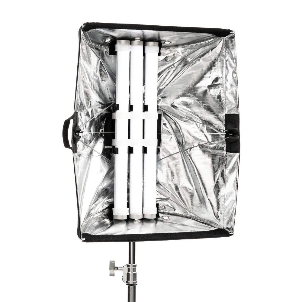 Astera softbox adapter bracket system with multiple Titan LED tube lights mounted inside silver reflective softbox on light stand for professional film and studio lighting on white background