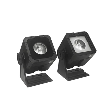 Astera StealthCover for PixelBrick two fixtures side by side comparison with cover installed and without cover showing lens black housing transparent background
