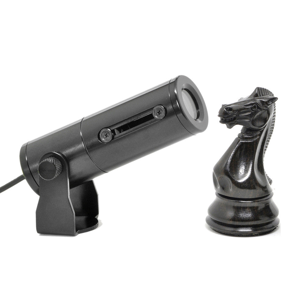 Gantom iQx micro image projector gobo projecting image onto black chess knight piece demonstration on white background