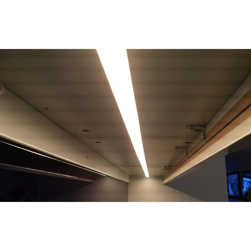 MossLED MOSS-ALM-2310 aluminum LED channel ceiling installation with LED strip illuminated showing warm white light output in real application