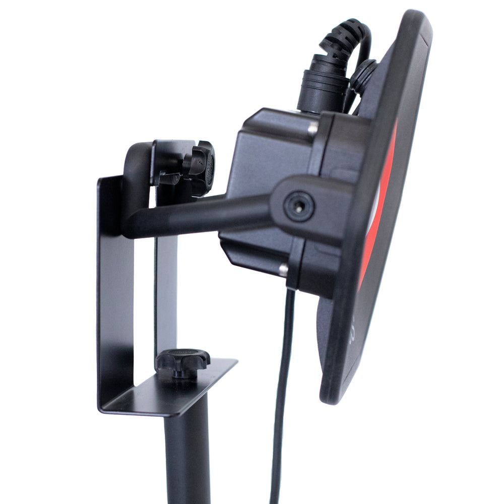 Moss LED CWLS cable wall mount bracket with LED light fixture installed rear view showing black metal L-shaped mounting bracket with cable routing and thumbscrew clamps holding round LED light on white background