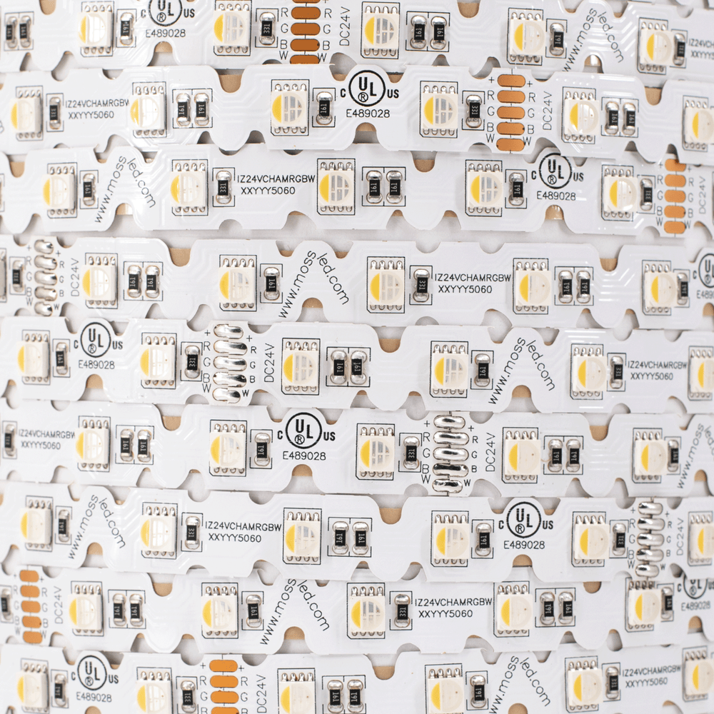 Moss LED FlexLED Chameleon 24V Fully Bendable – flat-lay macro close-up of RGB+W strip showing V-cut PCB pattern, SMD 5060 LEDs, R/G/B/W wire labels, UL listed