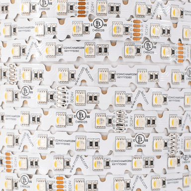 Moss LED FlexLED Chameleon 24V Fully Bendable – flat-lay macro close-up of RGB+W strip showing V-cut PCB pattern, SMD 5060 LEDs, R/G/B/W wire labels, UL listed