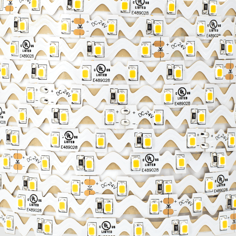 Moss LED FlexLED Chameleon 24V Fully Bendable – warm white 2730K, SMD 2835 chip detail, wave-cut white PCB flat-lay macro, DC 24V, UL listed