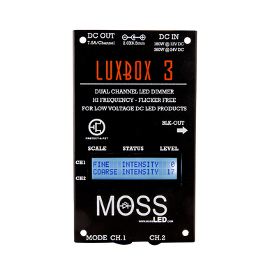 Moss LED LUXBOX 3 dual channel LED dimmer front panel closeup showing LCD display with intensity levels, scale status and level controls, DC in/out connectors, and blackout button