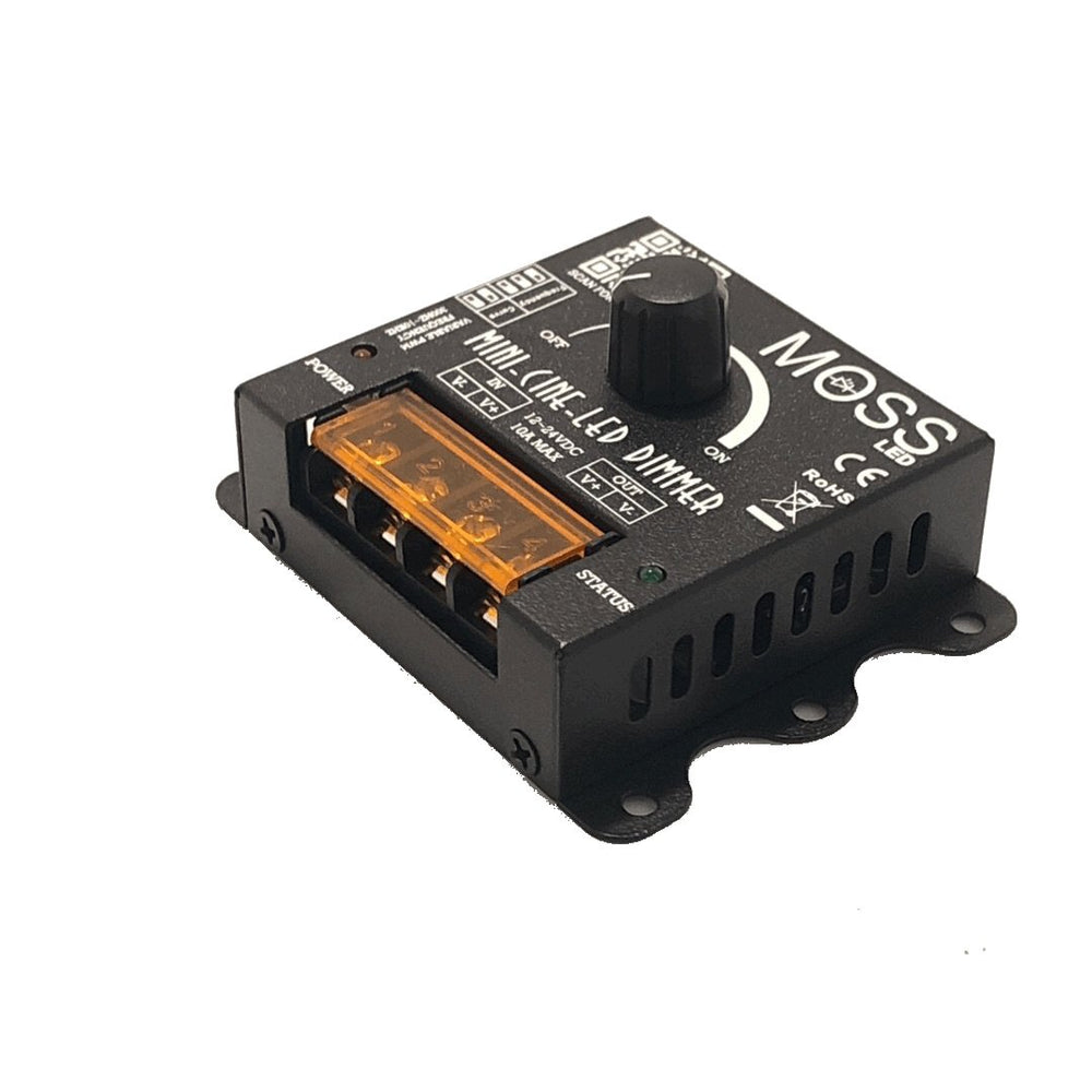 Moss LED Mini-Cine single channel rotary dimmer V2 terminal wiring side view showing orange plug-in connector block power input label and dimmer knob on black enclosure