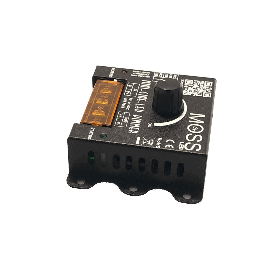 Moss LED Mini-Cine single channel rotary dimmer V2 top down view showing product label specifications orange terminal block rotary knob and ventilation slots on white background