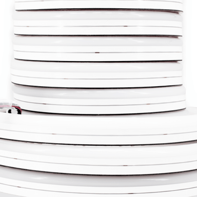 Moss LED Neon FlexLED V3 24V RGBW 2700K 480 LEDs/m close-up side view of coiled neon silicone LED strip reel on white background