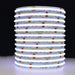 Moss LED SoftFLEX LED 784 RGBW 24V COB chip-on-board LED strip coiled reel illuminated with blue light on dark background