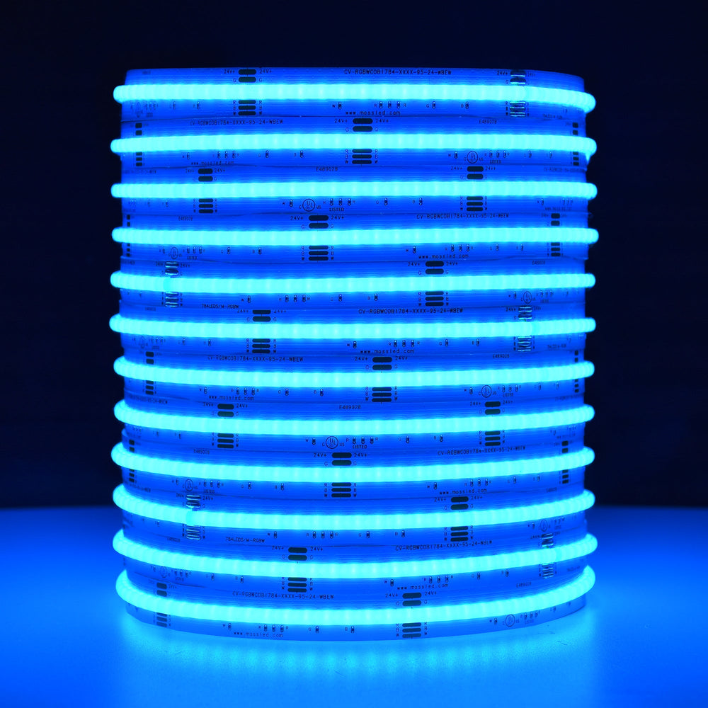 Moss LED SoftFLEX LED 784 RGBW 24V COB chip-on-board LED strip coiled reel illuminated with cyan light on dark background