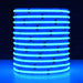 Moss LED SoftFLEX LED 784 RGBW 24V COB chip-on-board LED strip coiled reel illuminated with cyan light on dark background