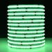 Moss LED SoftFLEX LED 784 RGBW 24V COB chip-on-board LED strip coiled reel illuminated with green light on dark background