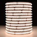 Moss LED SoftFLEX LED 784 RGBW 24V COB chip-on-board LED strip coiled reel illuminated with warm white 2700K light on dark background