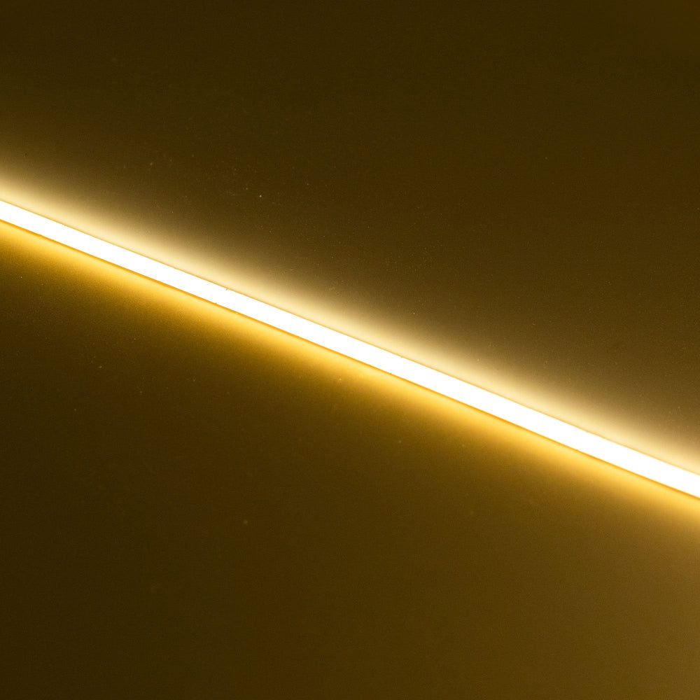Moss LED SoftFLEX Slim LED 528 2700K warm white 24V lit LED strip running diagonally on dark background