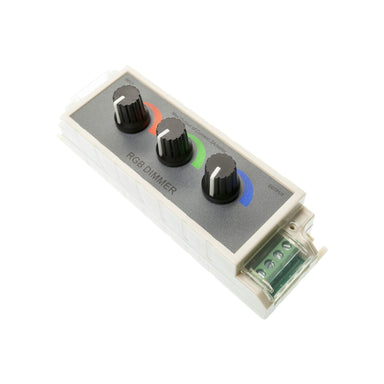 Moss LED three channel RGB rotary dimmer angled perspective showing black control knobs with red green and blue indicator rings, green terminal block connector, white enclosure RGB LED controller