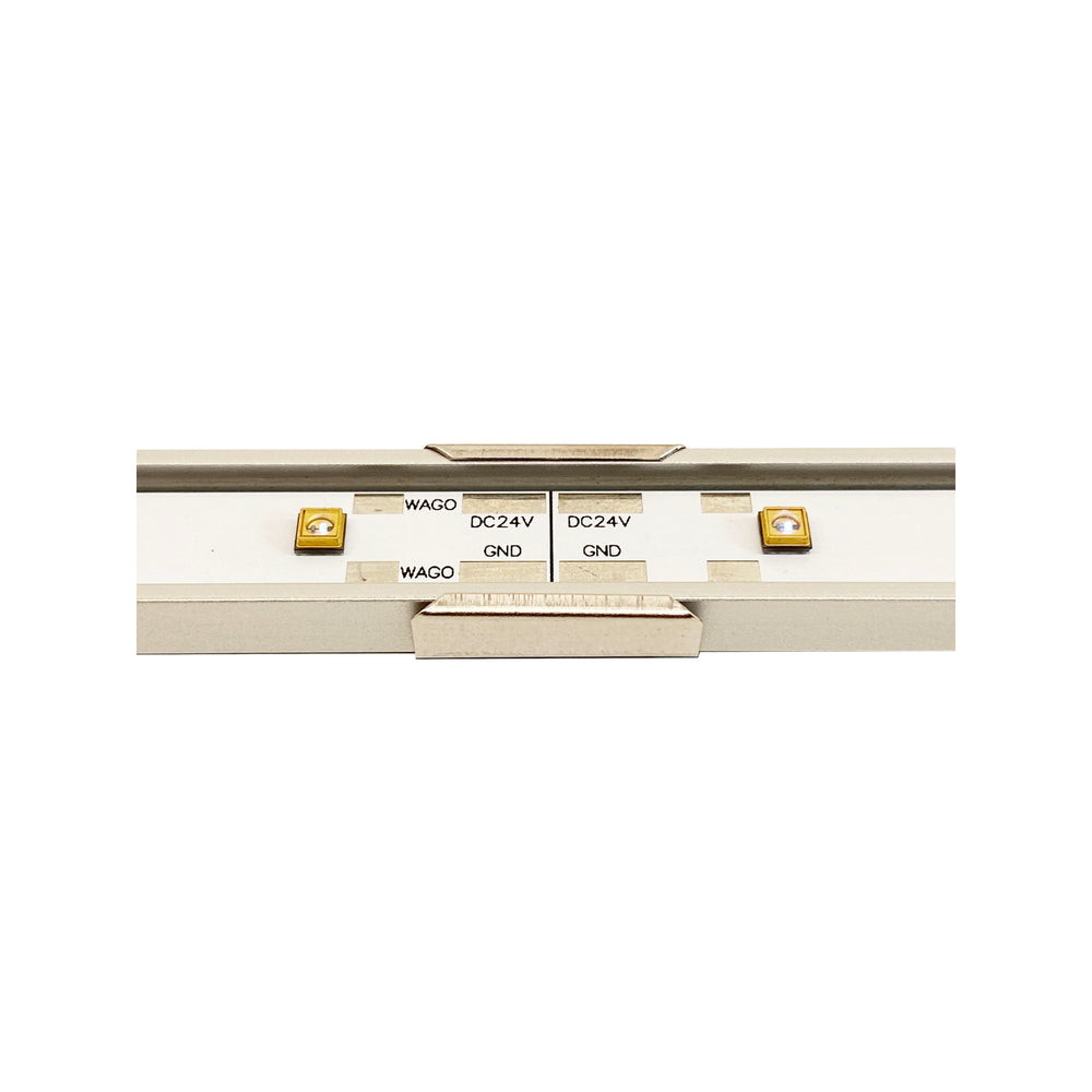 Moss LED UV-C LED bar with mounting clip attached showing WAGO connectors, DC24V and GND labels on PCB