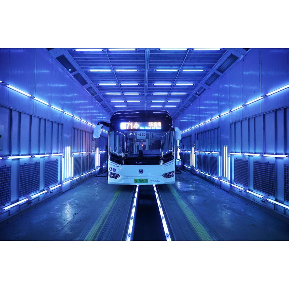 Osram AirZing UV-C disinfection application showing bus in UV light tunnel with blue germicidal lighting