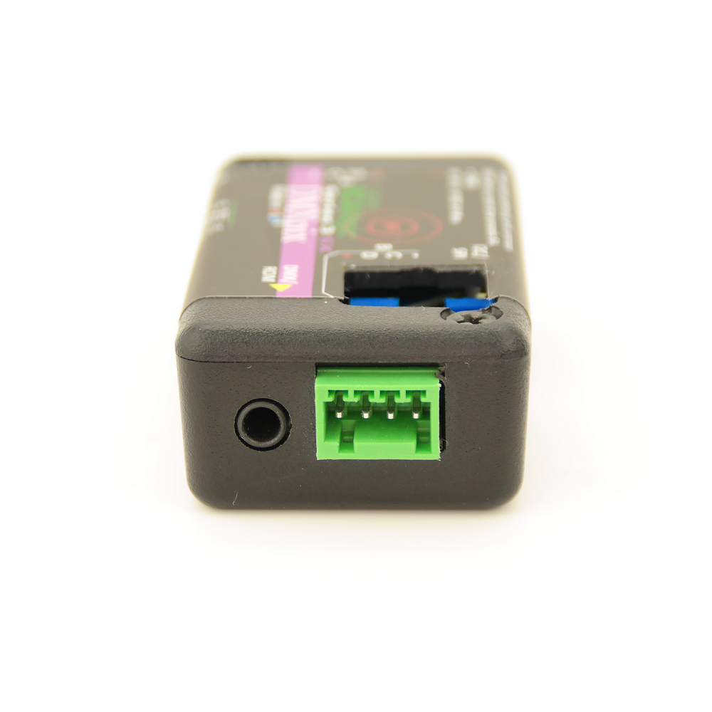 RC4 Wireless RC4Magic 2.4GHz Series 3 DMXpix dual pixel string driver side view showing DC power jack green Phoenix connector for DC IN 5-35VDC 6A power input and DMX RDM data port on black compact housing on white background