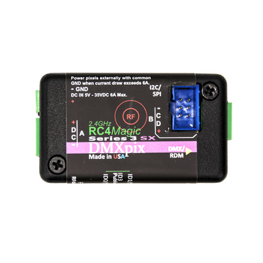 RC4 Wireless RC4Magic 2.4GHz Series 3 DMXpix dual pixel string driver top view showing product label with RC4Magic branding DMX RDM port I2C SPI connector DC IN 5-35VDC 6A Max GND RF indicator Phoenix connectors Made in USA on white background