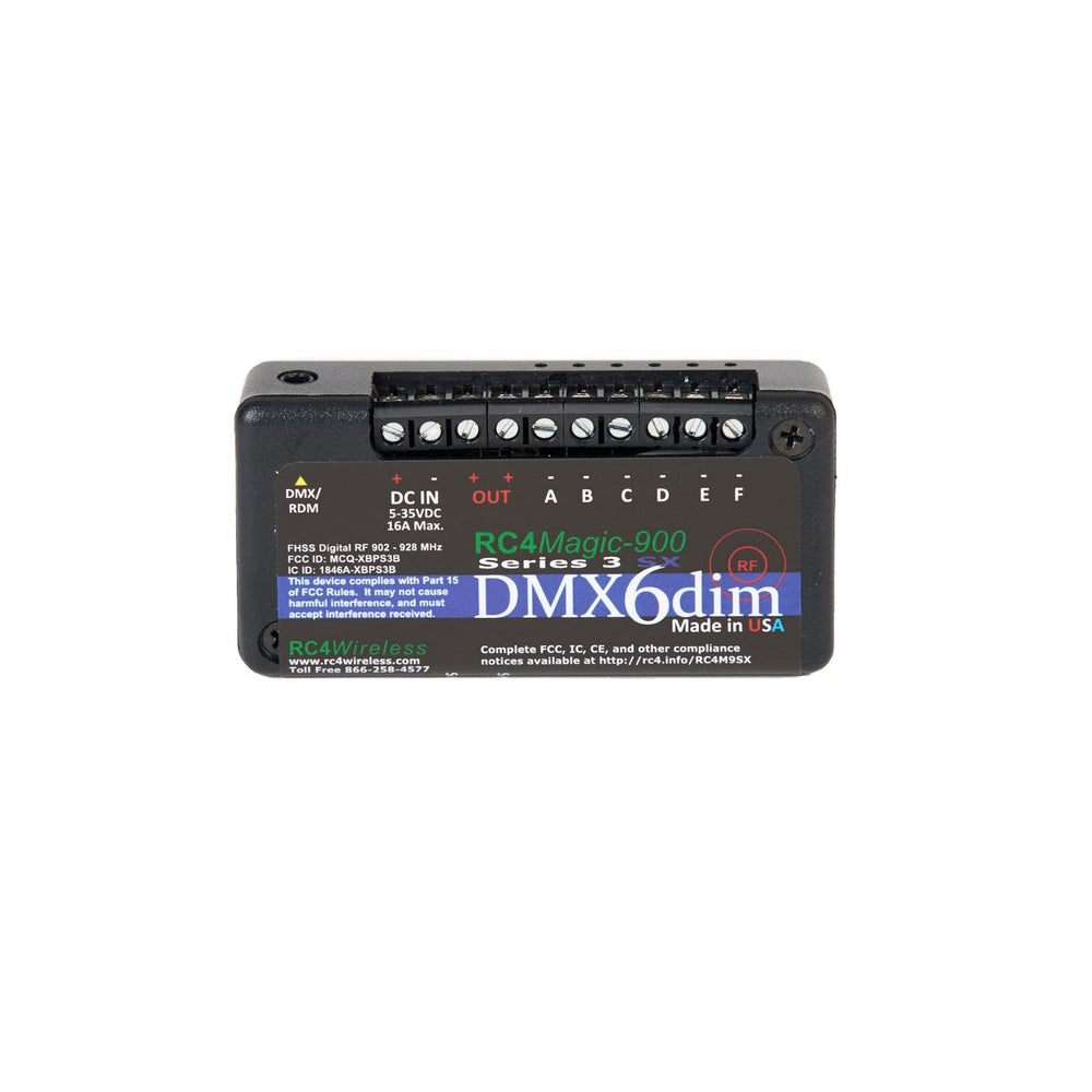 RC4 Wireless RC4Magic-900 Series 3 DMX6dim 6-channel wireless DMX dimmer front view showing black compact housing with detailed FCC compliance labels DMX RDM input DC IN power connector screw terminal outputs A through F red green status LEDs RC4Magic-900 Series 3 branding DMX6dim logo and Made in USA badge on white background