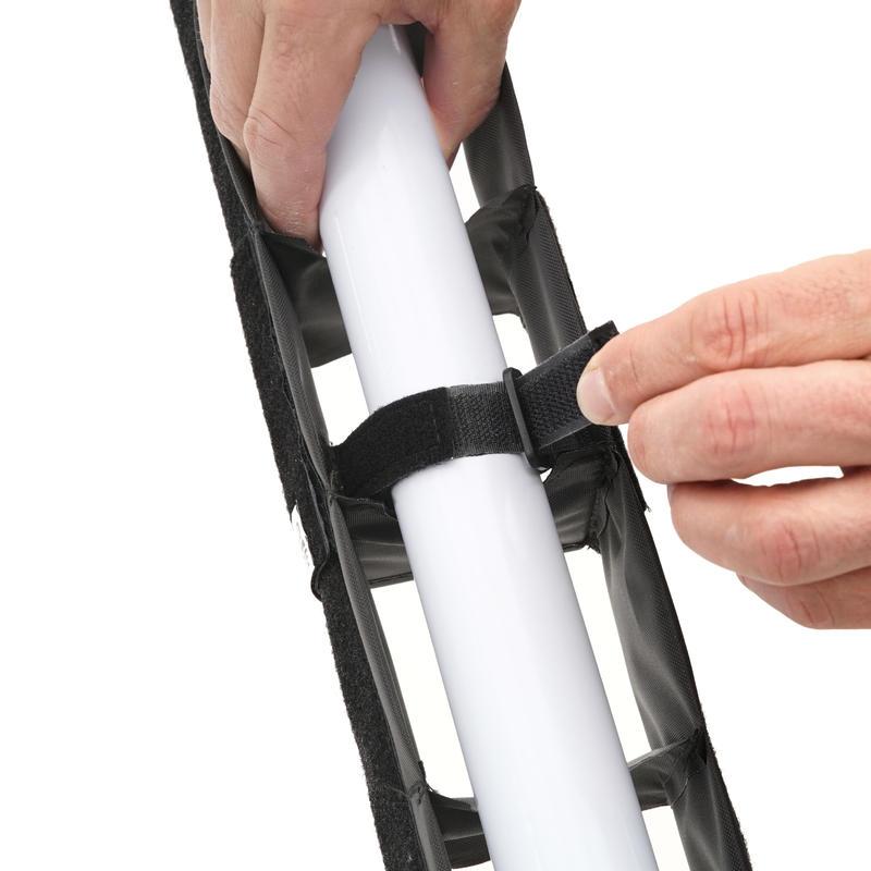 SNAPGRID 40 degree installation close-up showing hands securing velcro strap around Astera AX1 Titan tube to attach grid accessory